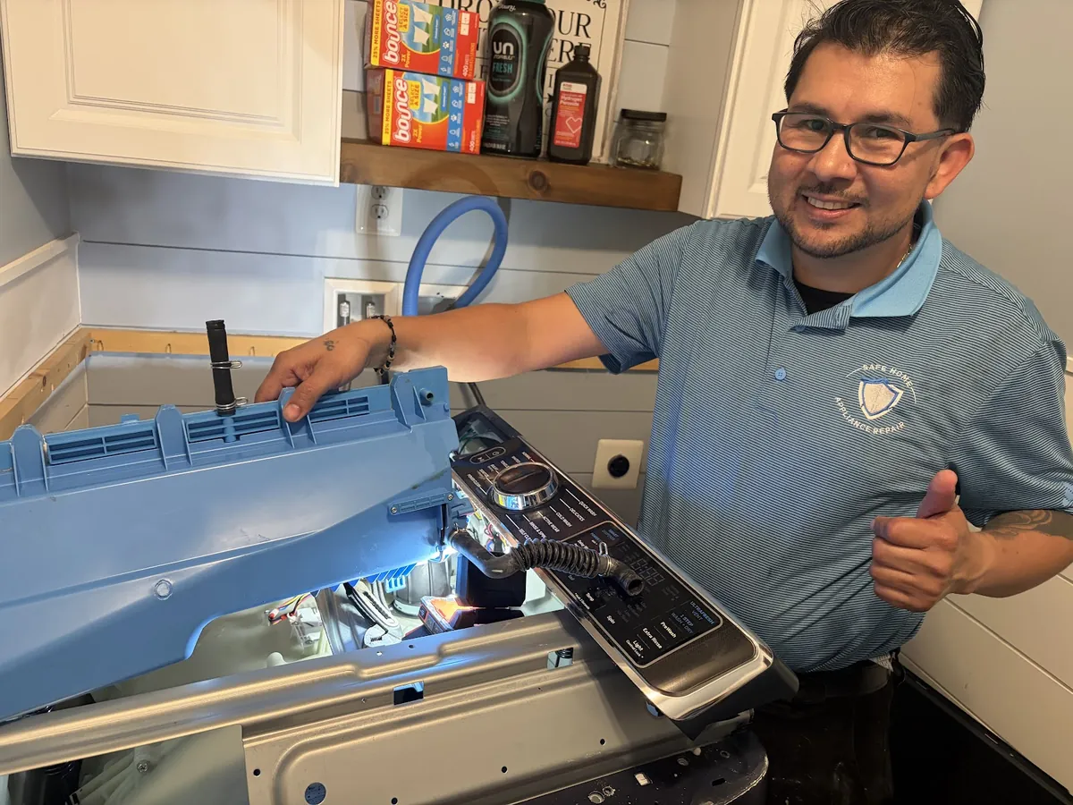 Miguel repairing a dishwasher control panel in a kitchen