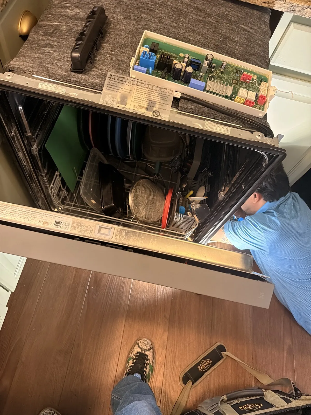 Dishwasher control board accessed from beneath the counter
